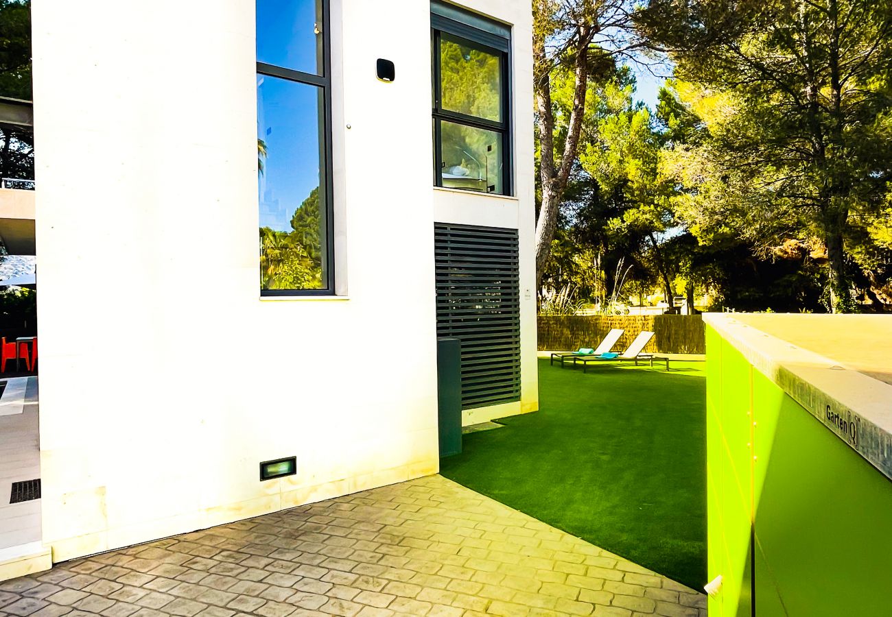 This is the exterior of the modern holiday home, which as you can see is surrounded by the garden.