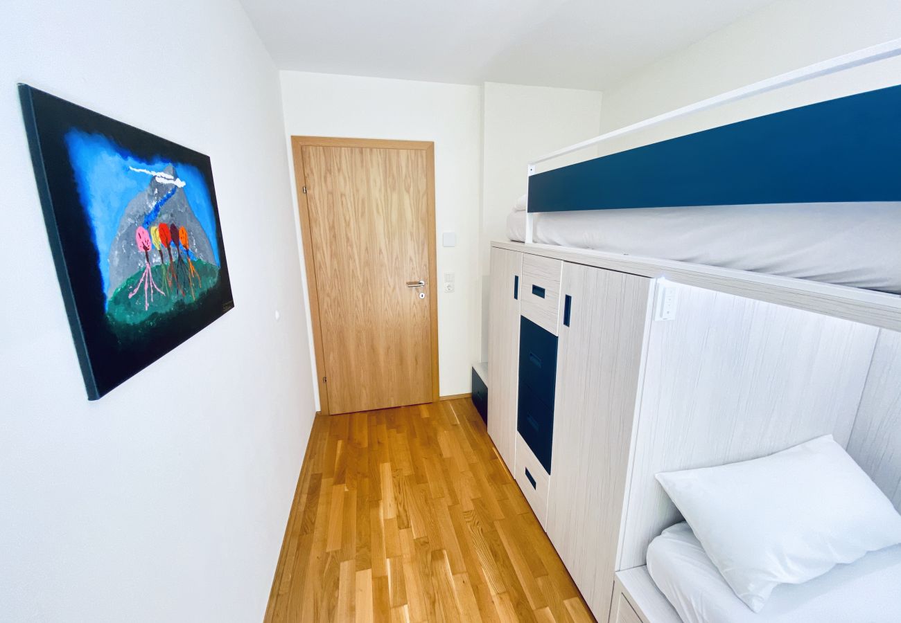 Every child's dream bedroom features a loft bed and other child-friendly items.