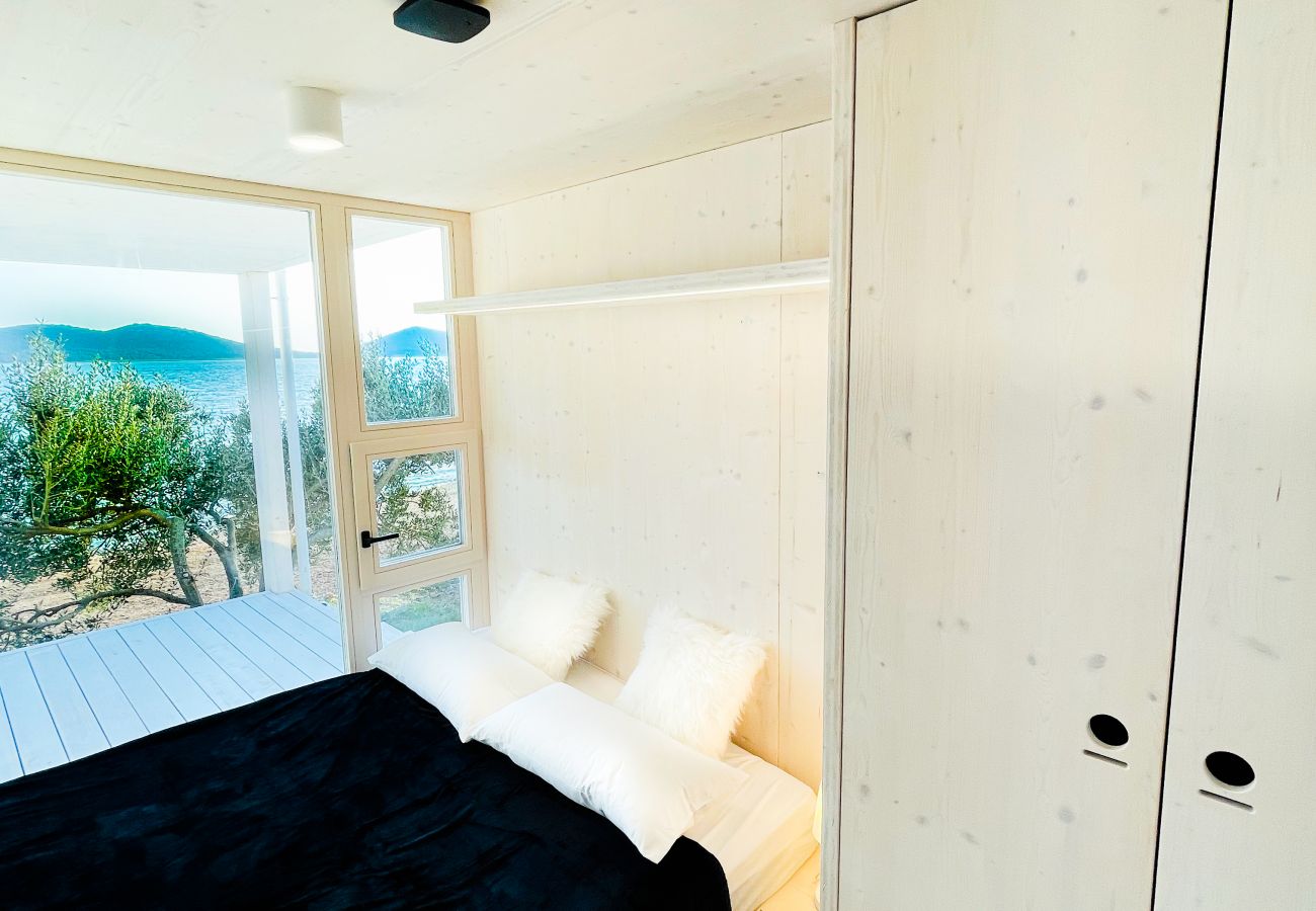 This is the modern bedroom with a great view of the sea.