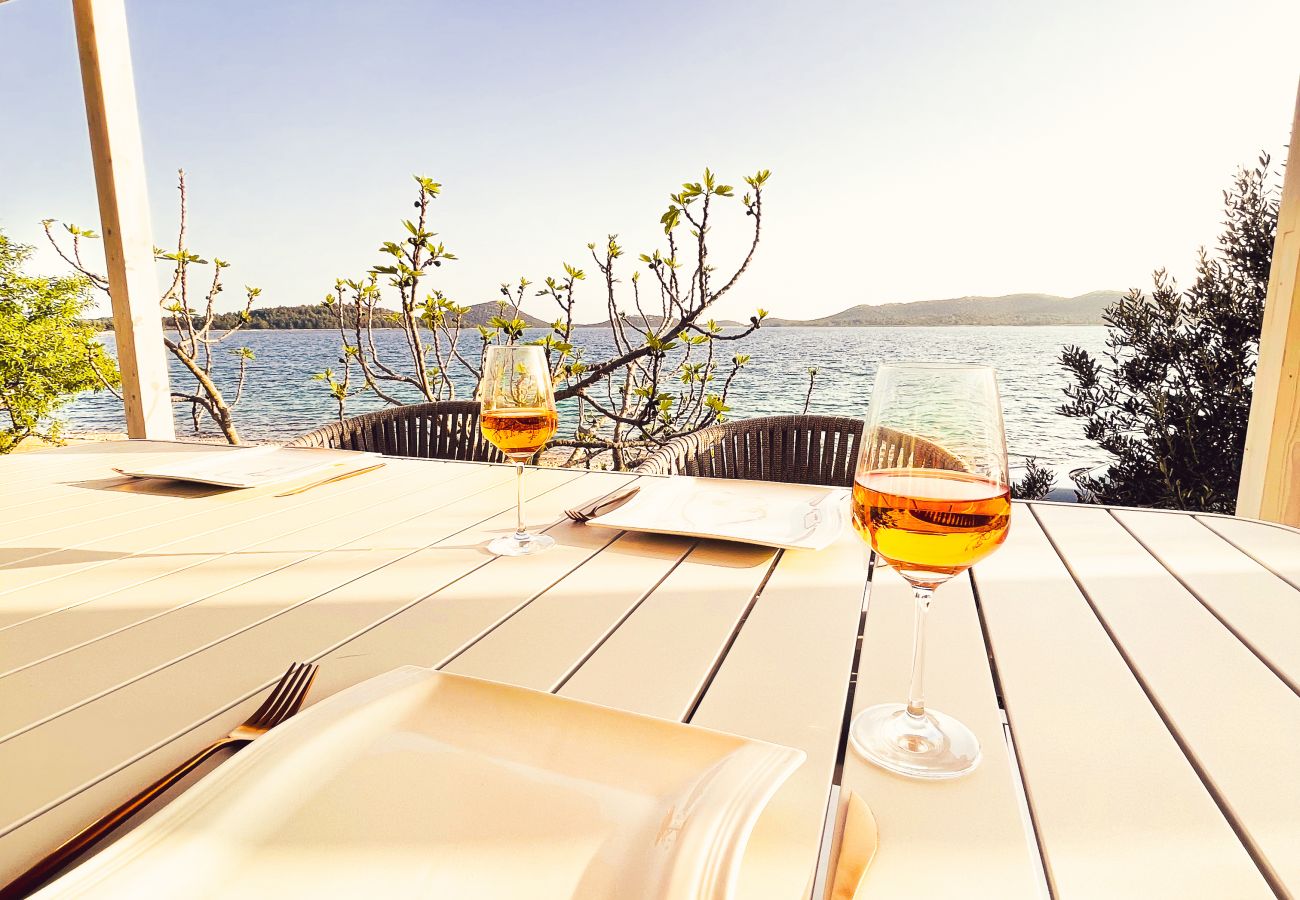 From the dining table you have a great view of the big blue sea that is right in front of you.