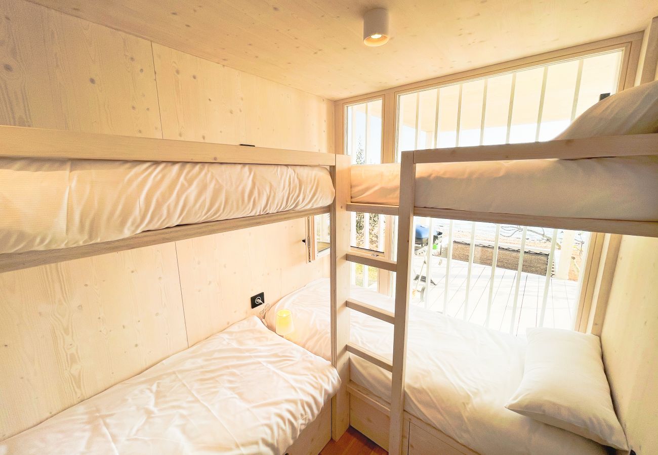 In the children's bedroom there are two modern bunk beds