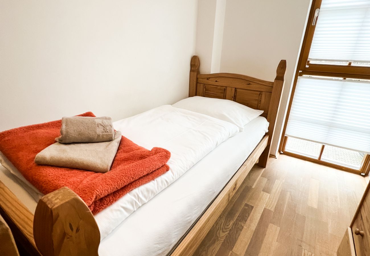 The bedroom has two single beds. In addition to the beautiful design, there is a view of the mountains at the end.