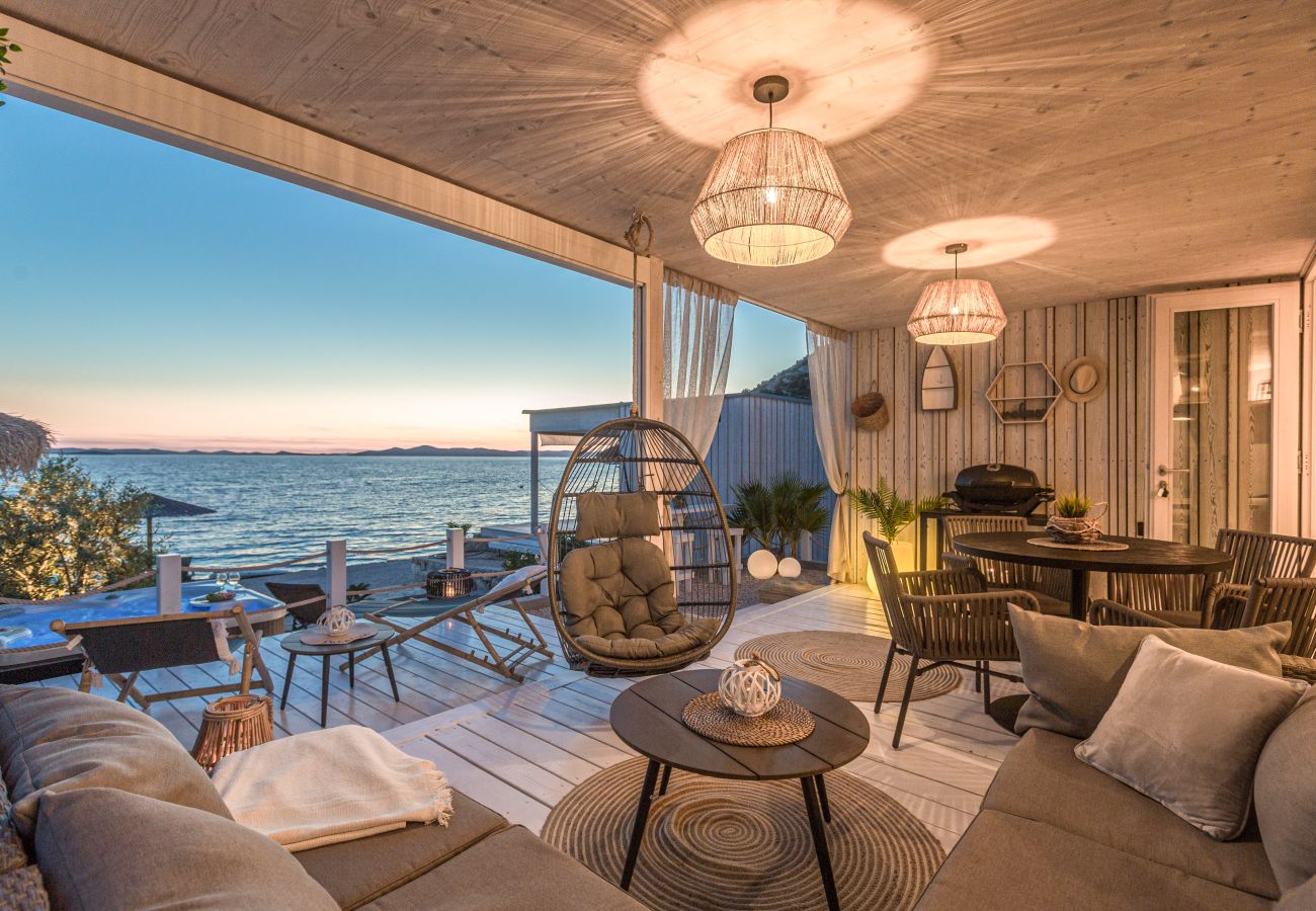 Terrace with a seating area, a hanging chair and other relaxation options with sea views